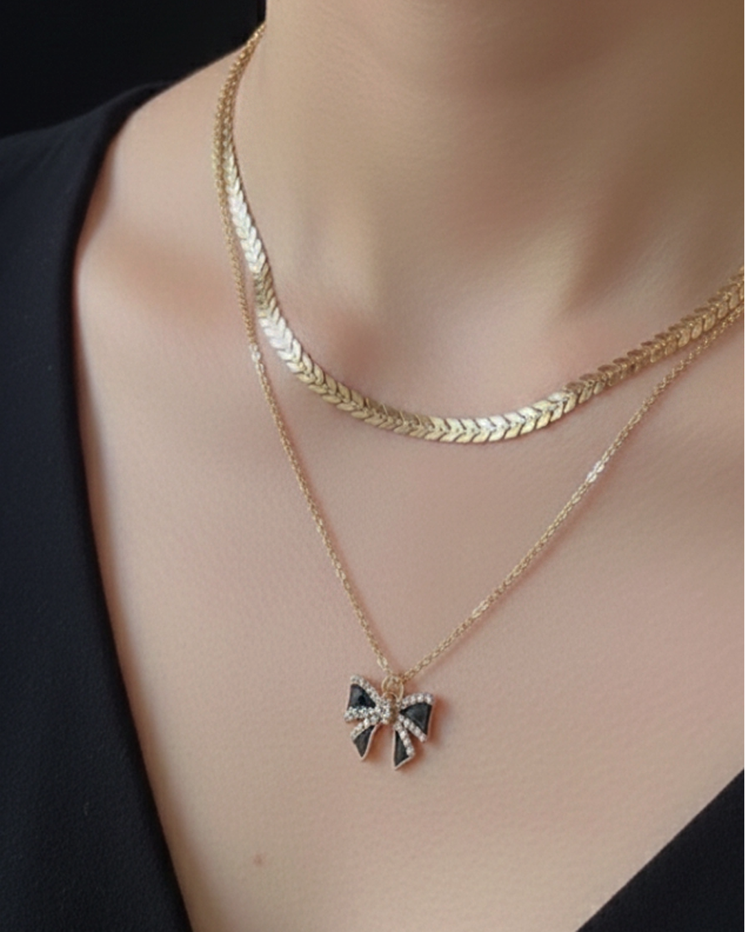 Double-chain Necklace With Bow Pendant.